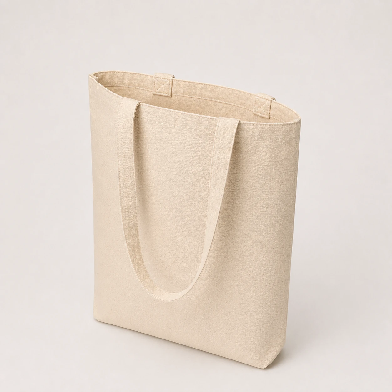 Open natural cotton tote showing its interior and handles