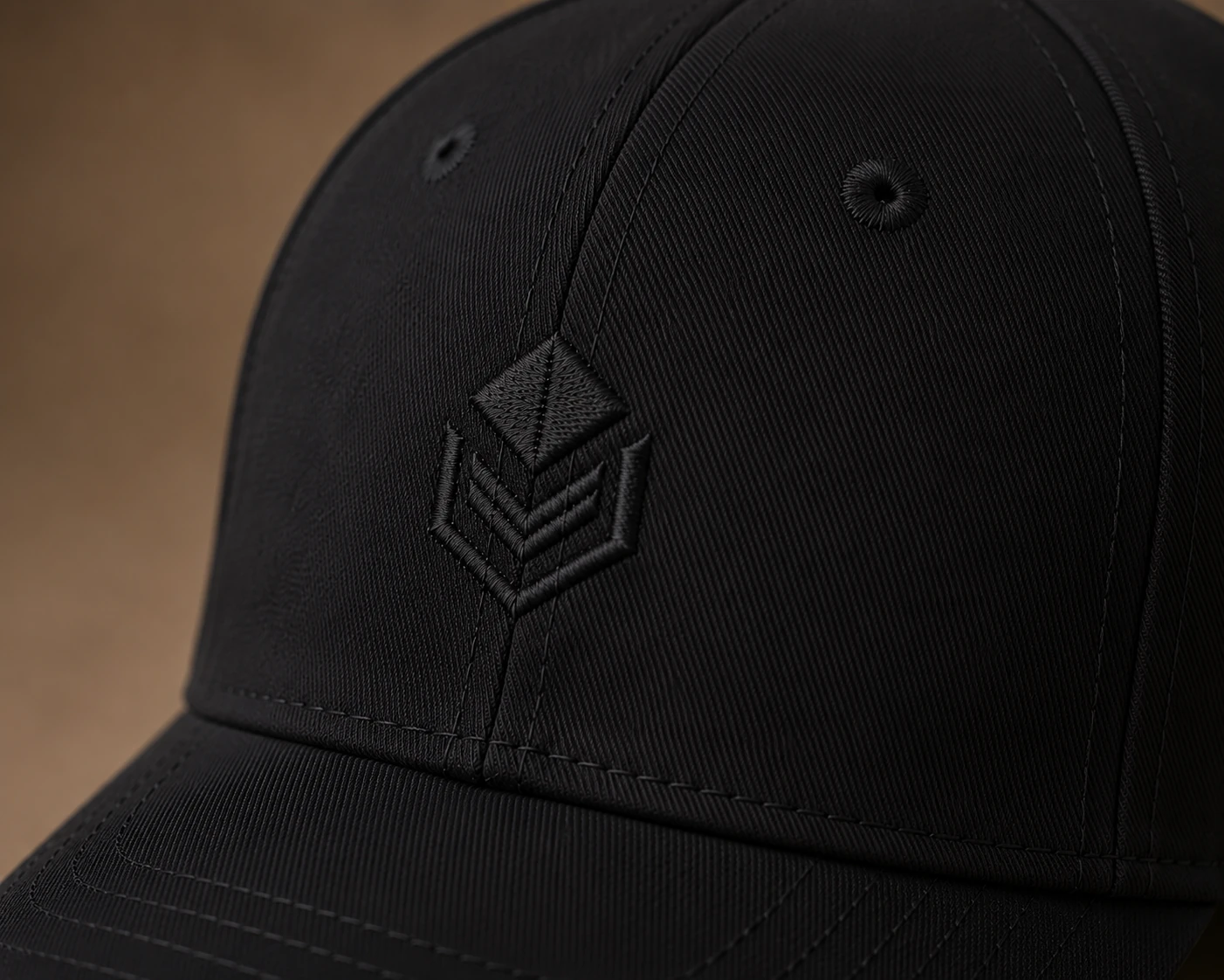 Close-up of tonal embroidery on a black cap