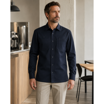 Professional man wearing the deep ink navy long-sleeve Custom Work Shirt visual reference.